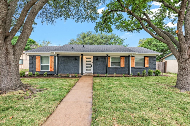 ranch-style home with a front lawn