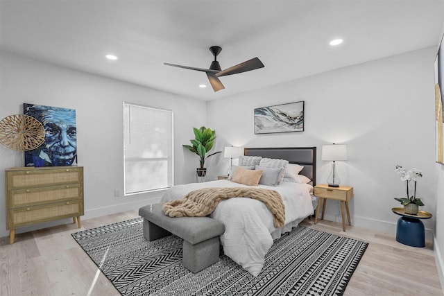 bedroom featuring ceiling fan and light hardwood / wood-style floors