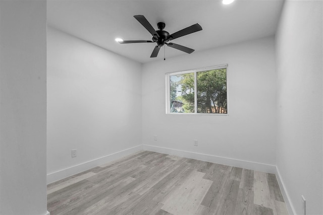 unfurnished room featuring ceiling fan and light hardwood / wood-style flooring