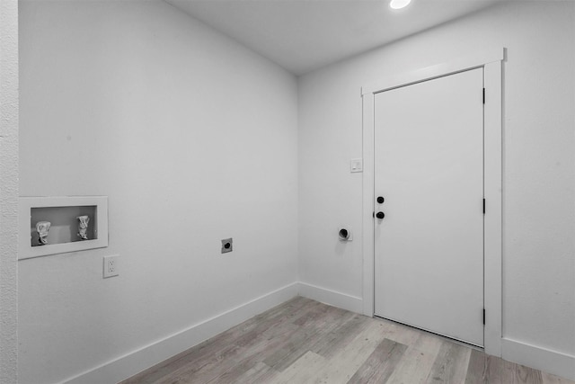 laundry room featuring washer hookup, electric dryer hookup, and light hardwood / wood-style flooring