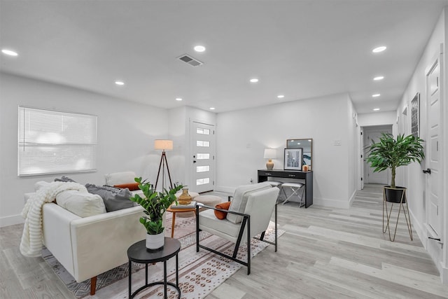 living room with light hardwood / wood-style floors