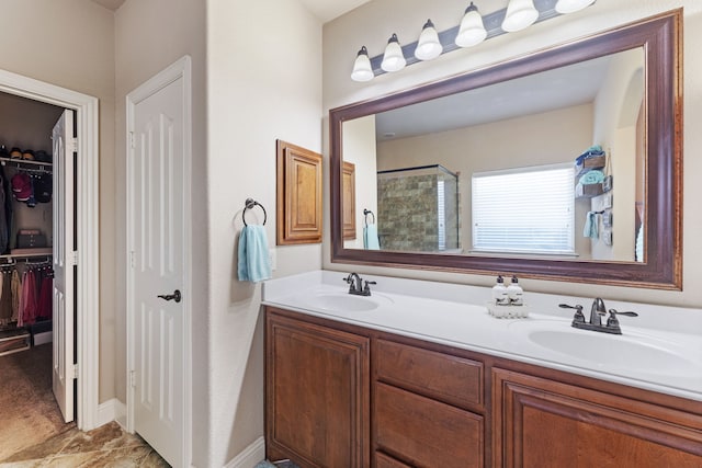 bathroom with vanity and a shower