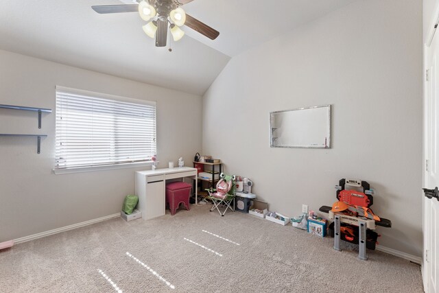 interior space featuring ceiling fan, carpet floors, and vaulted ceiling