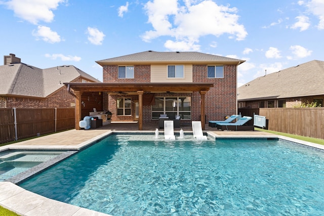 view of pool featuring outdoor lounge area, ceiling fan, an in ground hot tub, and a patio