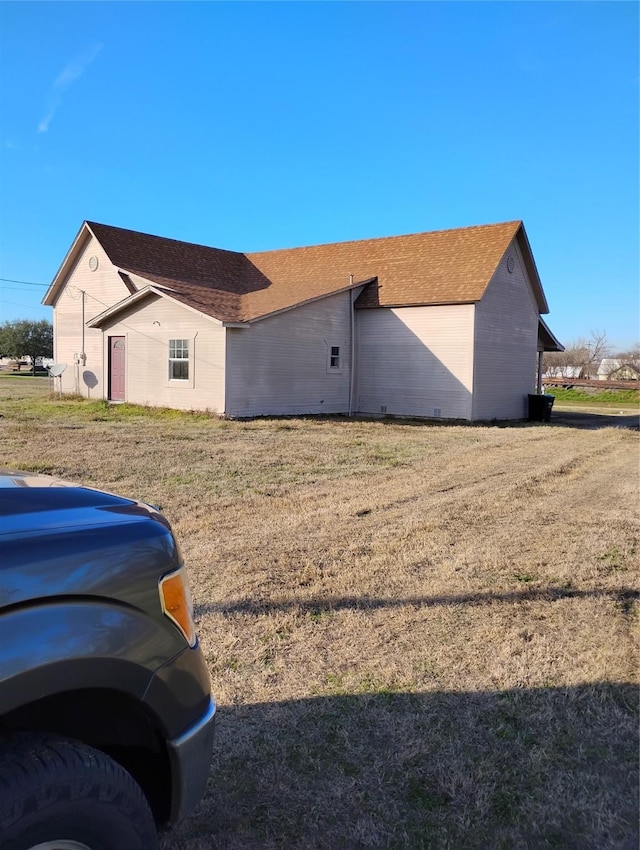 view of home's exterior with a lawn