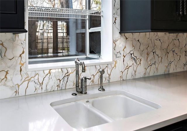 interior space with tasteful backsplash and sink