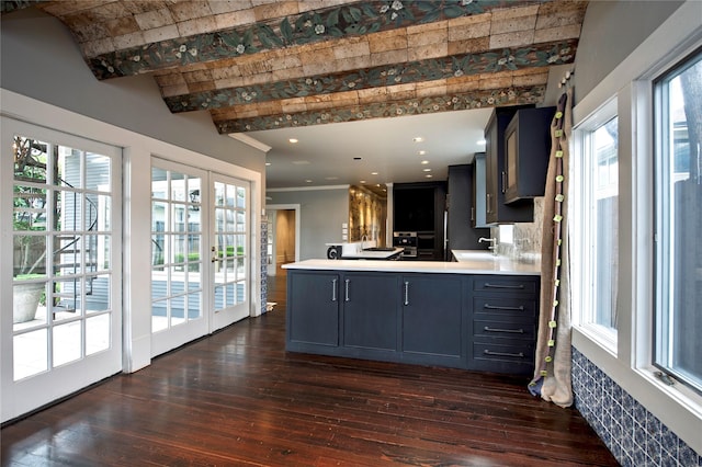 kitchen with dark wood-type flooring, french doors, beam ceiling, kitchen peninsula, and brick ceiling