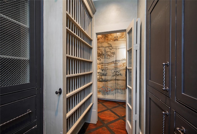 walk in closet featuring dark tile patterned floors