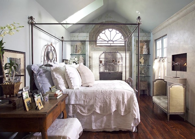 bedroom featuring dark hardwood / wood-style flooring and vaulted ceiling