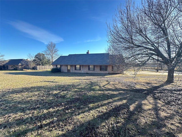 ranch-style house with a front yard