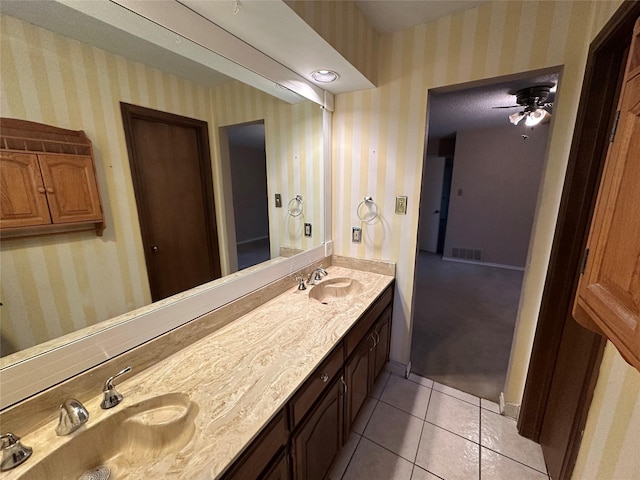 bathroom with ceiling fan, vanity, and tile patterned floors