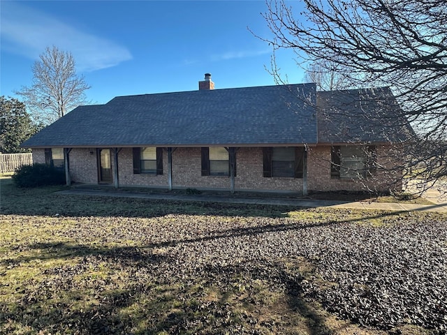 rear view of house with a lawn