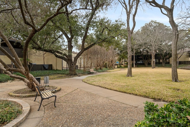 view of property's community featuring a yard