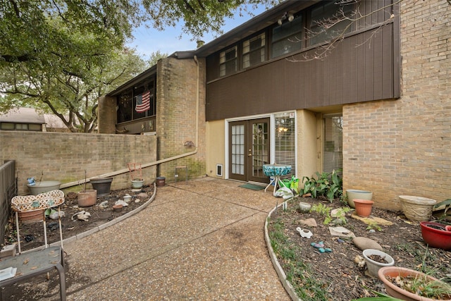 view of patio featuring french doors