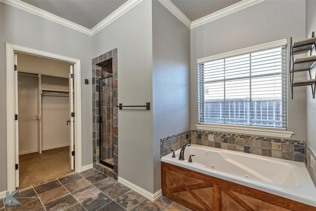 bathroom with ornamental molding and shower with separate bathtub