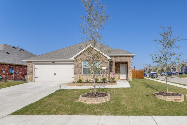 ranch-style house featuring a garage and a front lawn