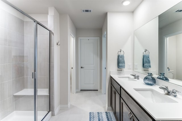 bathroom featuring vanity, tile patterned floors, and an enclosed shower