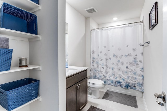 full bathroom featuring tile patterned flooring, vanity, shower / tub combo, and toilet