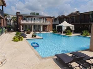 view of swimming pool with a patio