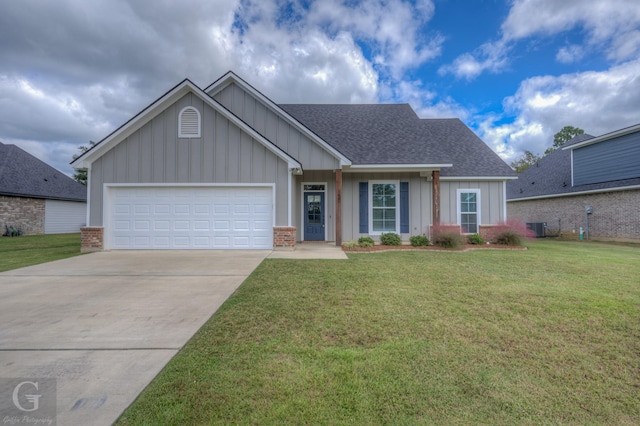 view of front of home featuring a garage and a front yard