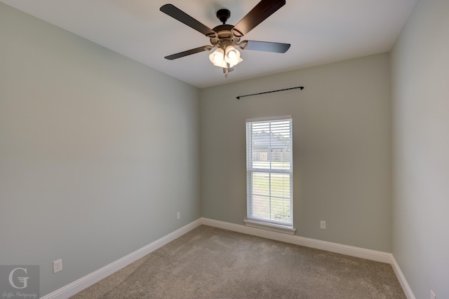 carpeted empty room with ceiling fan