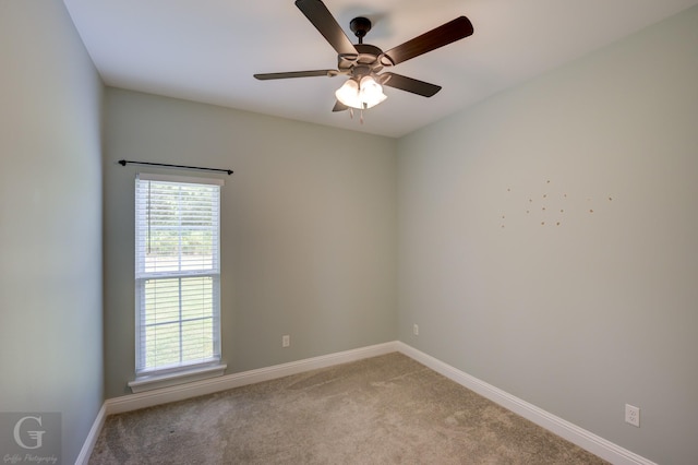 empty room with light carpet and ceiling fan