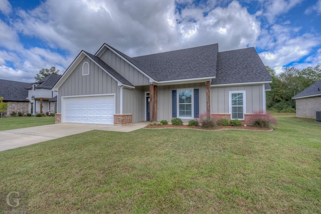 view of front of house featuring a garage, a front yard, and central air condition unit