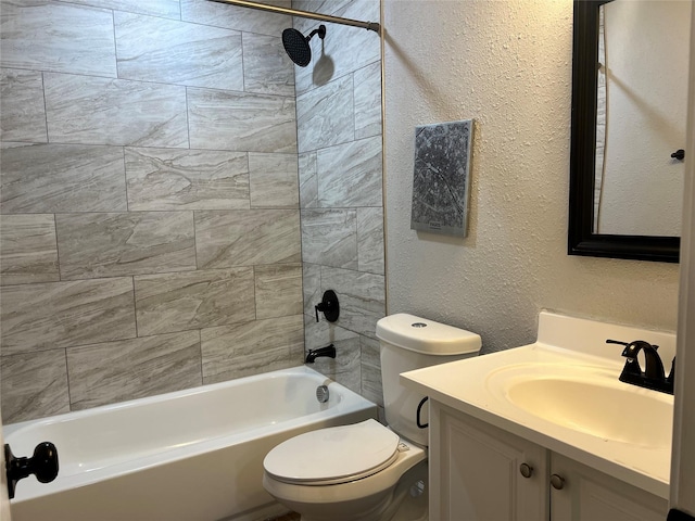 full bathroom with toilet, vanity, and tiled shower / bath combo