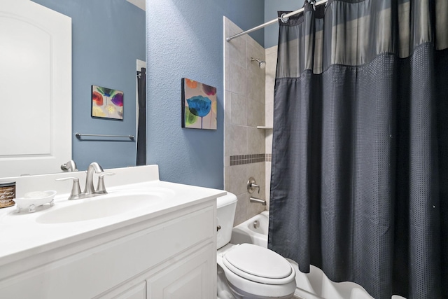 full bathroom featuring shower / bath combination with curtain, toilet, and vanity