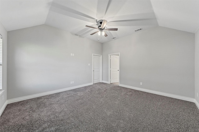 carpeted empty room with ceiling fan and lofted ceiling