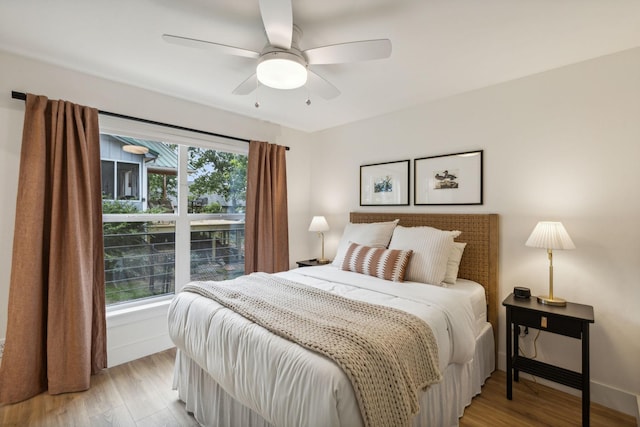 bedroom featuring ceiling fan and light hardwood / wood-style flooring