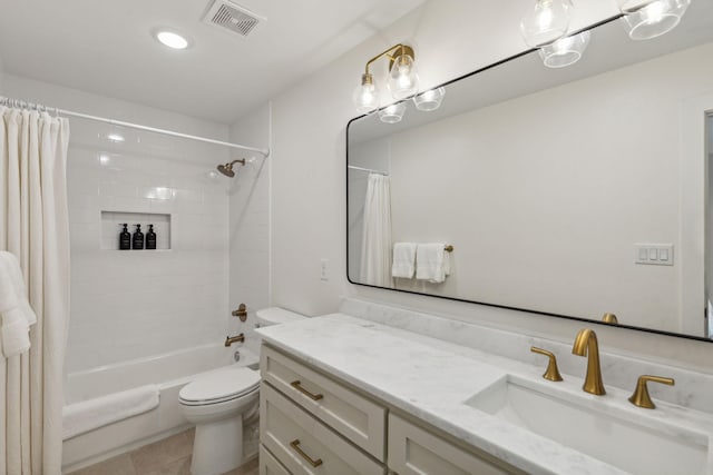 full bathroom featuring vanity, tile patterned flooring, toilet, and shower / bath combo with shower curtain