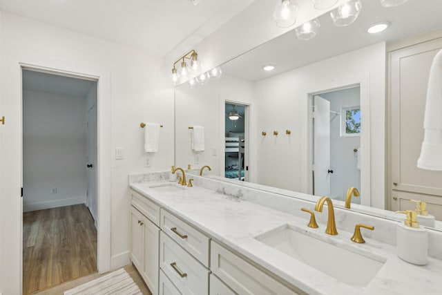 bathroom featuring vanity and wood-type flooring