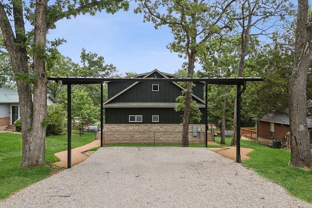 view of side of property with central air condition unit and a lawn