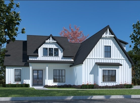 view of front of house featuring french doors and a front lawn