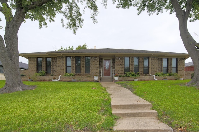 ranch-style home featuring a front yard