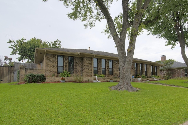 back of property featuring a lawn