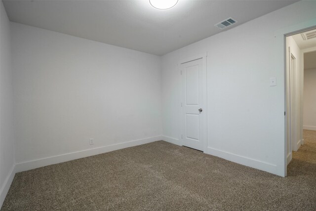 spare room featuring carpet floors