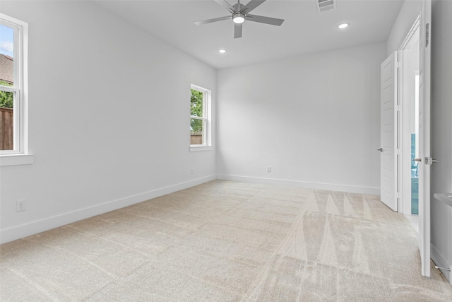 unfurnished bedroom with ceiling fan and light carpet