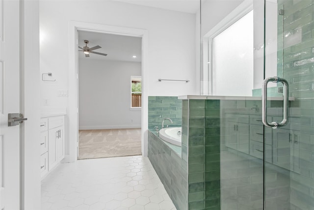 bathroom with shower with separate bathtub, vanity, tile patterned floors, and ceiling fan