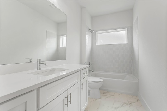 full bathroom featuring vanity, toilet, and tiled shower / bath