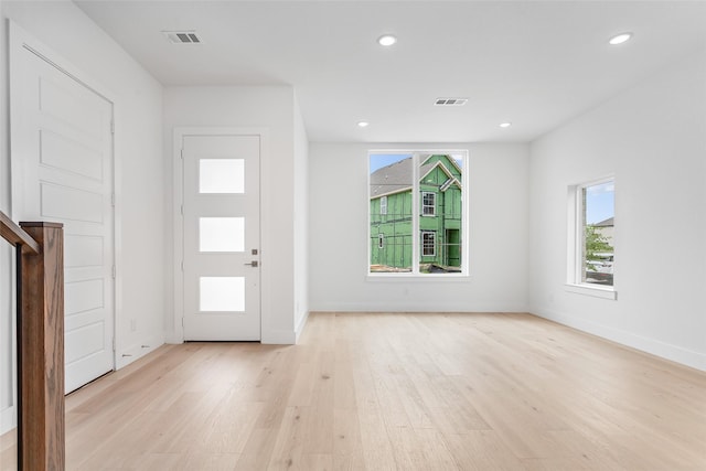 entrance foyer with light wood-type flooring and plenty of natural light