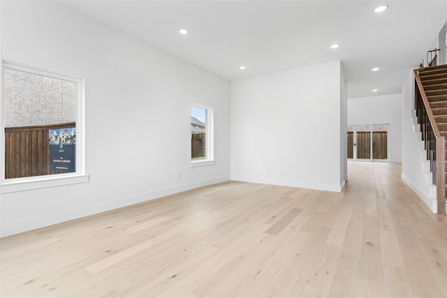 spare room featuring light wood-type flooring