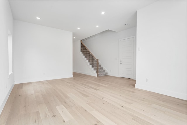 empty room with light hardwood / wood-style floors