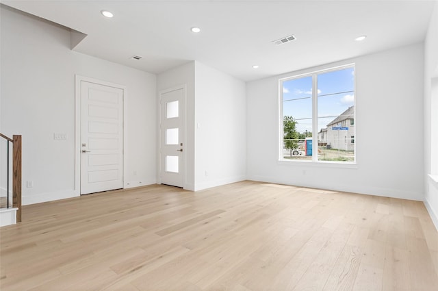 entryway with light hardwood / wood-style floors