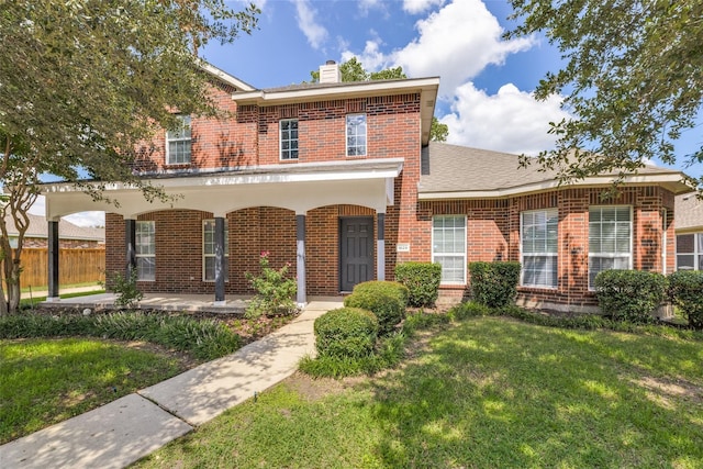 view of front of property featuring a front yard