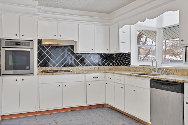 kitchen featuring sink, stainless steel appliances, light tile patterned floors, ventilation hood, and white cabinets