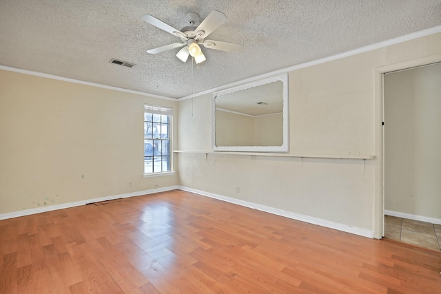 spare room with hardwood / wood-style flooring and ornamental molding