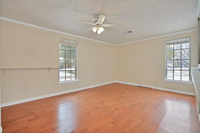 unfurnished room with a textured ceiling, light hardwood / wood-style floors, ceiling fan, and crown molding