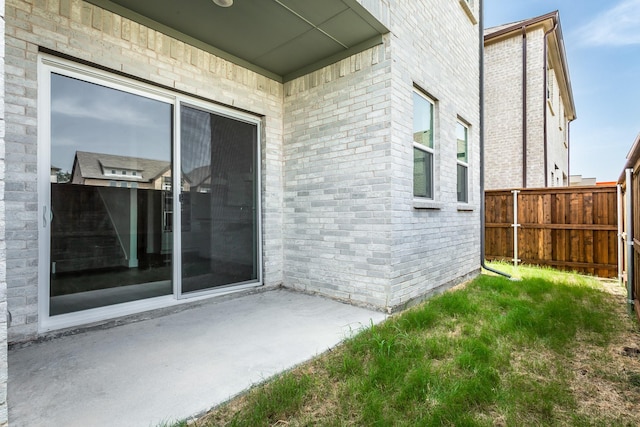 entrance to property with a patio area